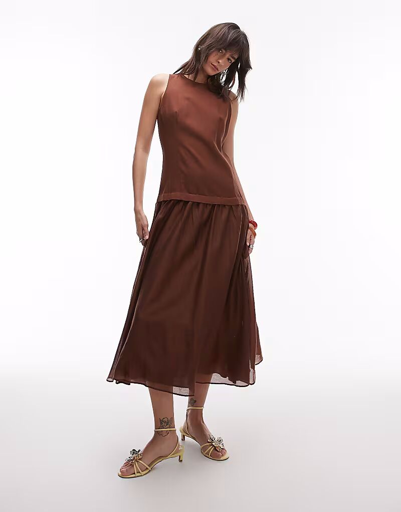 Длинное платье из льна Mango с заниженной талией и прозрачным подолом шоколадного цвета
Длинное платье из льна Mango с заниженной талией и прозрачным подолом шоколадного цвета
