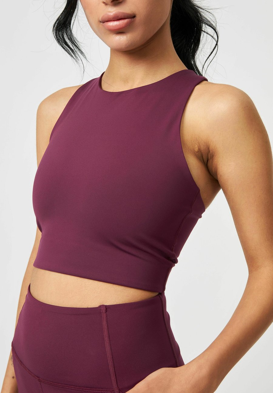 Бюстгальтер Girlfriend Collective DYLAN BRA, Plum/Purple
Бюстгальтер Girlfriend Collective DYLAN BRA, Plum/Purple