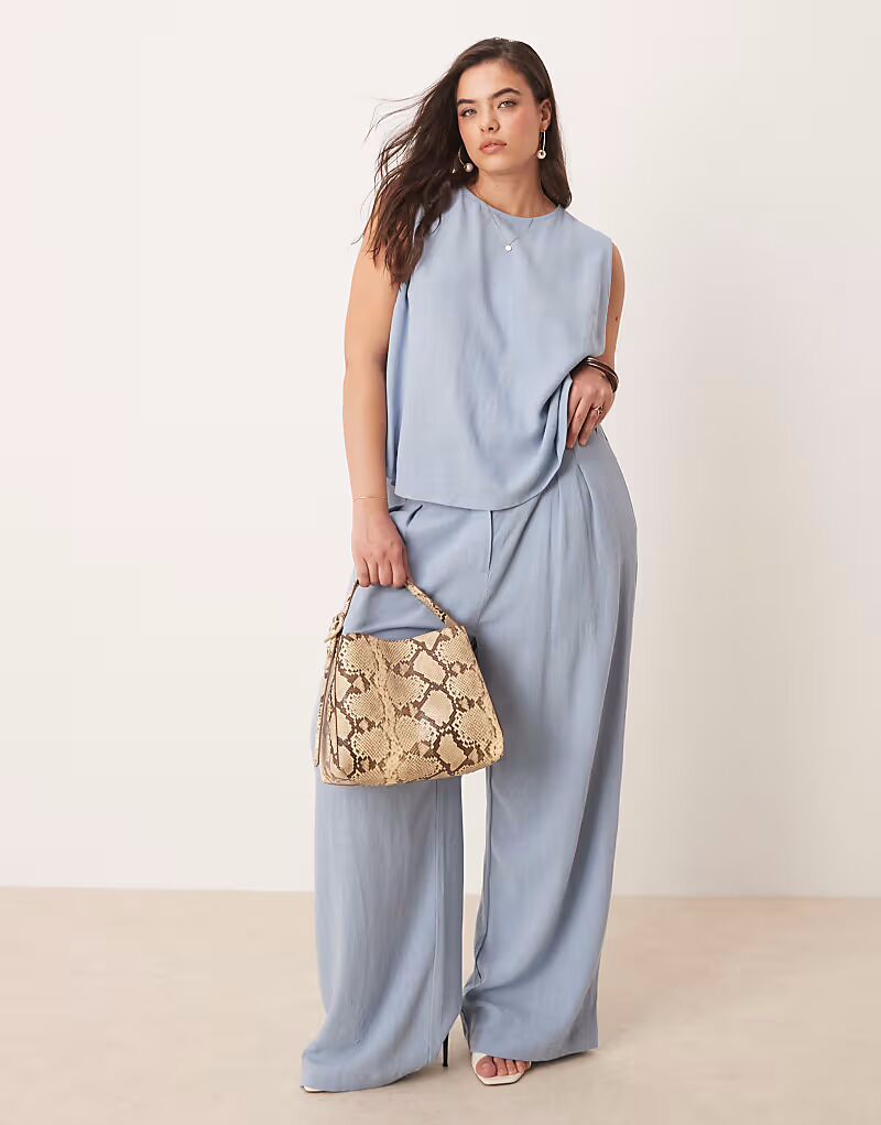 Широкие брюки ASOS DESIGN Curve со складками спереди и льняным комбинезоном синего цвета
Широкие брюки ASOS DESIGN Curve со складками спереди и льняным комбинезоном синего цвета