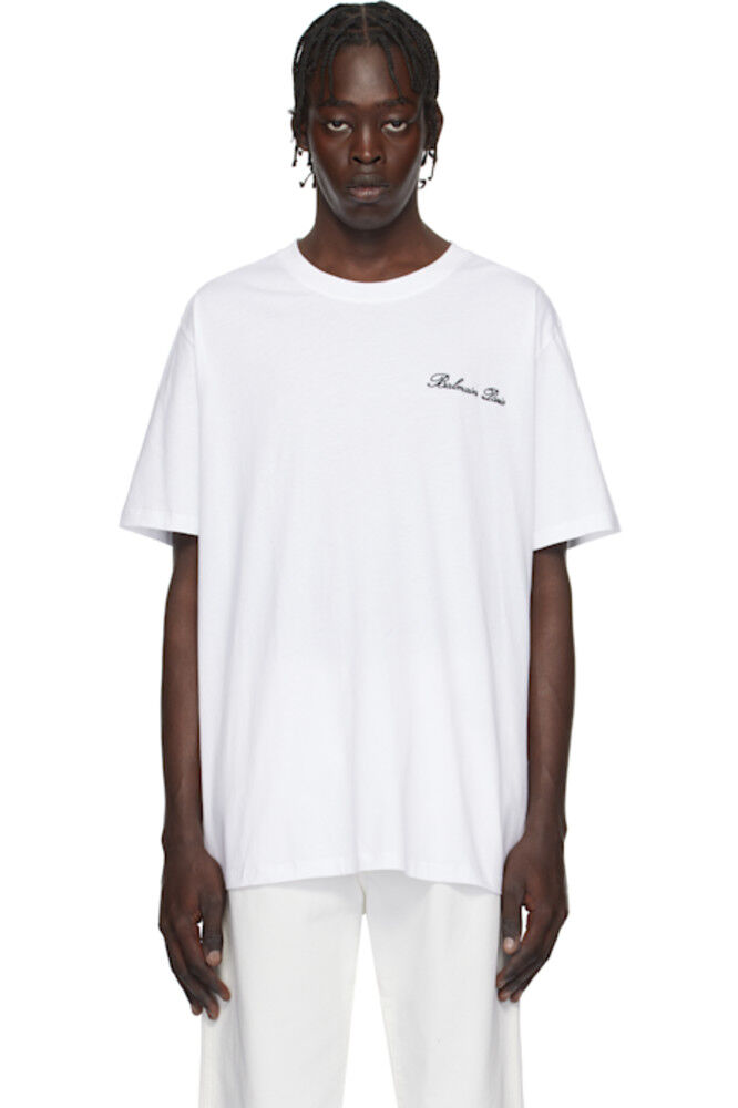 Белая свободная футболка с вышитой подписью «Balmain»
Белая свободная футболка с вышитой подписью «Balmain»