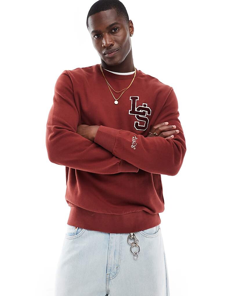 Levi's – красная толстовка с логотипом университета
Levi's – красная толстовка с логотипом университета