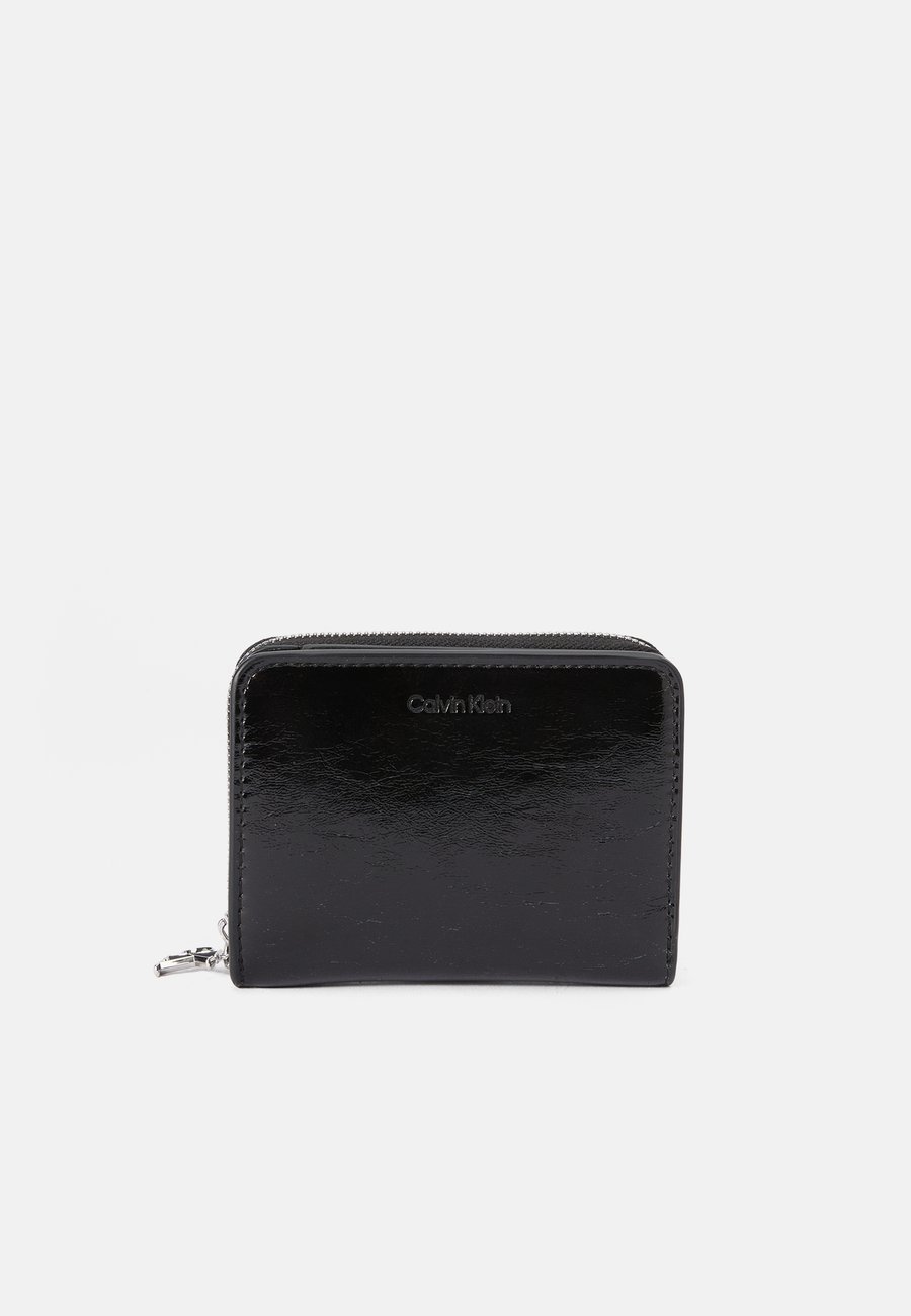 Кошелек Calvin Klein METALLIC FLAP ZIP AROUND, Black
Кошелек Calvin Klein METALLIC FLAP ZIP AROUND, Black