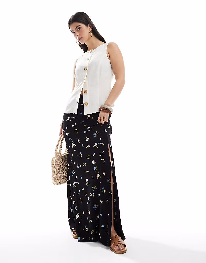Юбка макси ASOS DESIGN с высоким разрезом и цветочным принтом
Юбка макси ASOS DESIGN с высоким разрезом и цветочным принтом