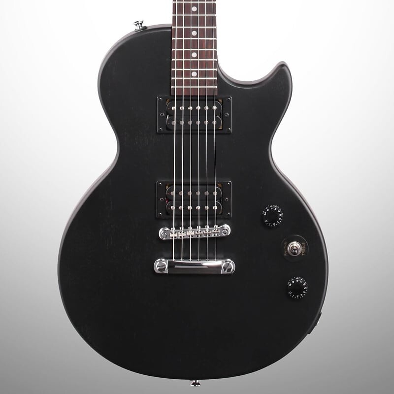 Электрогитара Epiphone Les Paul Special VE, винтажное черное дерево Les Paul Special VE Electric Guitar
Электрогитара Epiphone Les Paul Special VE, винтажное черное дерево Les Paul Special VE Electric Guitar