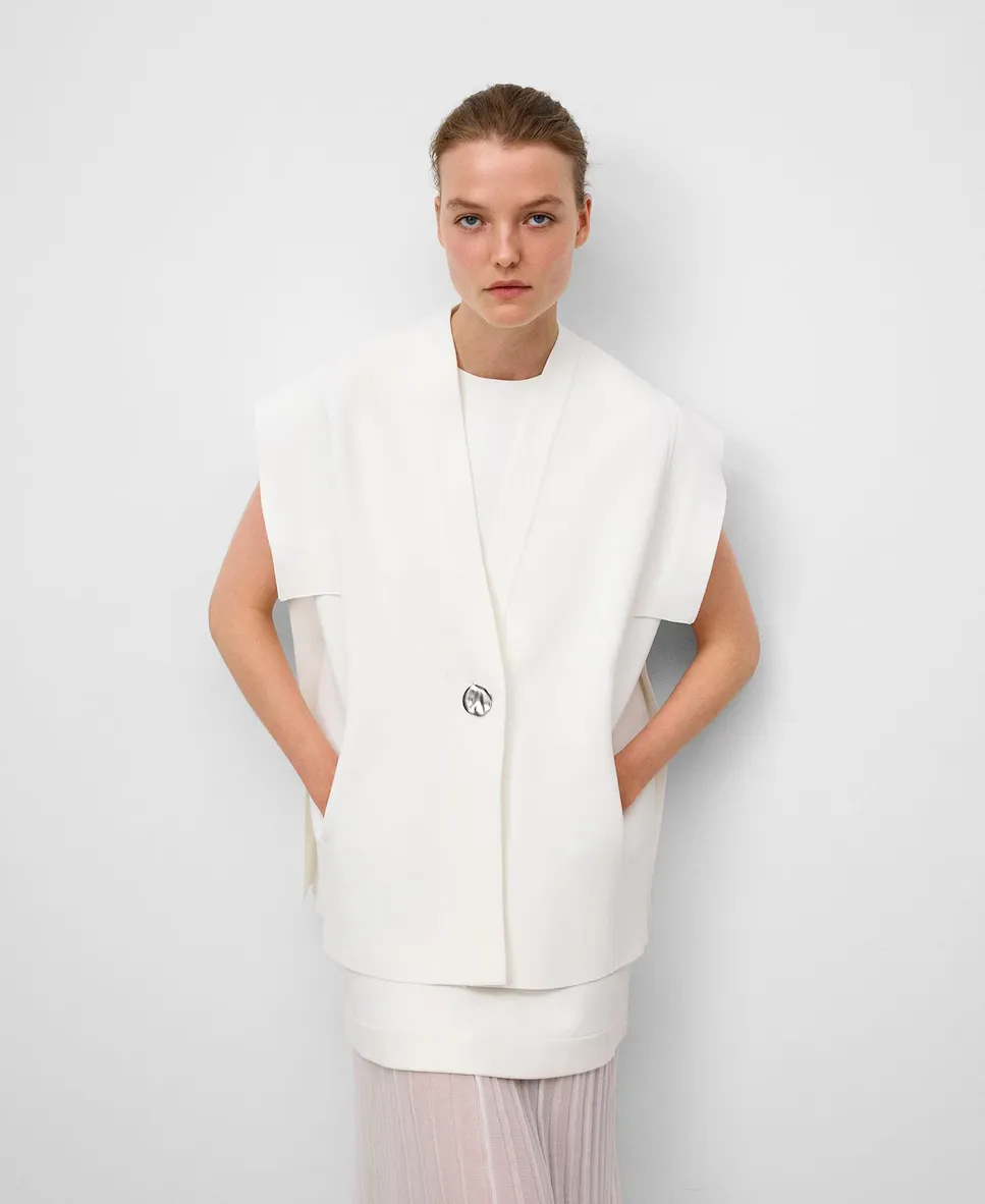 Женский вязаный жилет с боковыми деталями из гладкой ткани Adolfo Dominguez, цвет Crudo
Женский вязаный жилет с боковыми деталями из гладкой ткани Adolfo Dominguez, цвет Crudo