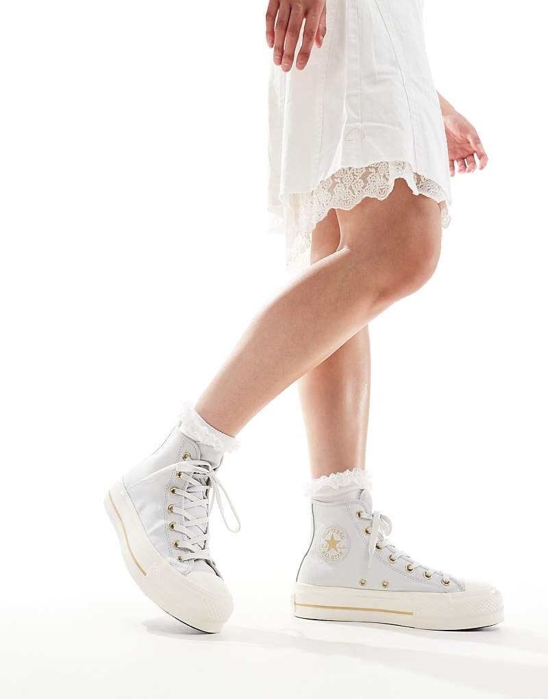 Converse Chuck Taylor All Star Lift Hi Серые спортивные туфли с золотыми вставками
Converse Chuck Taylor All Star Lift Hi Серые спортивные туфли с золотыми вставками