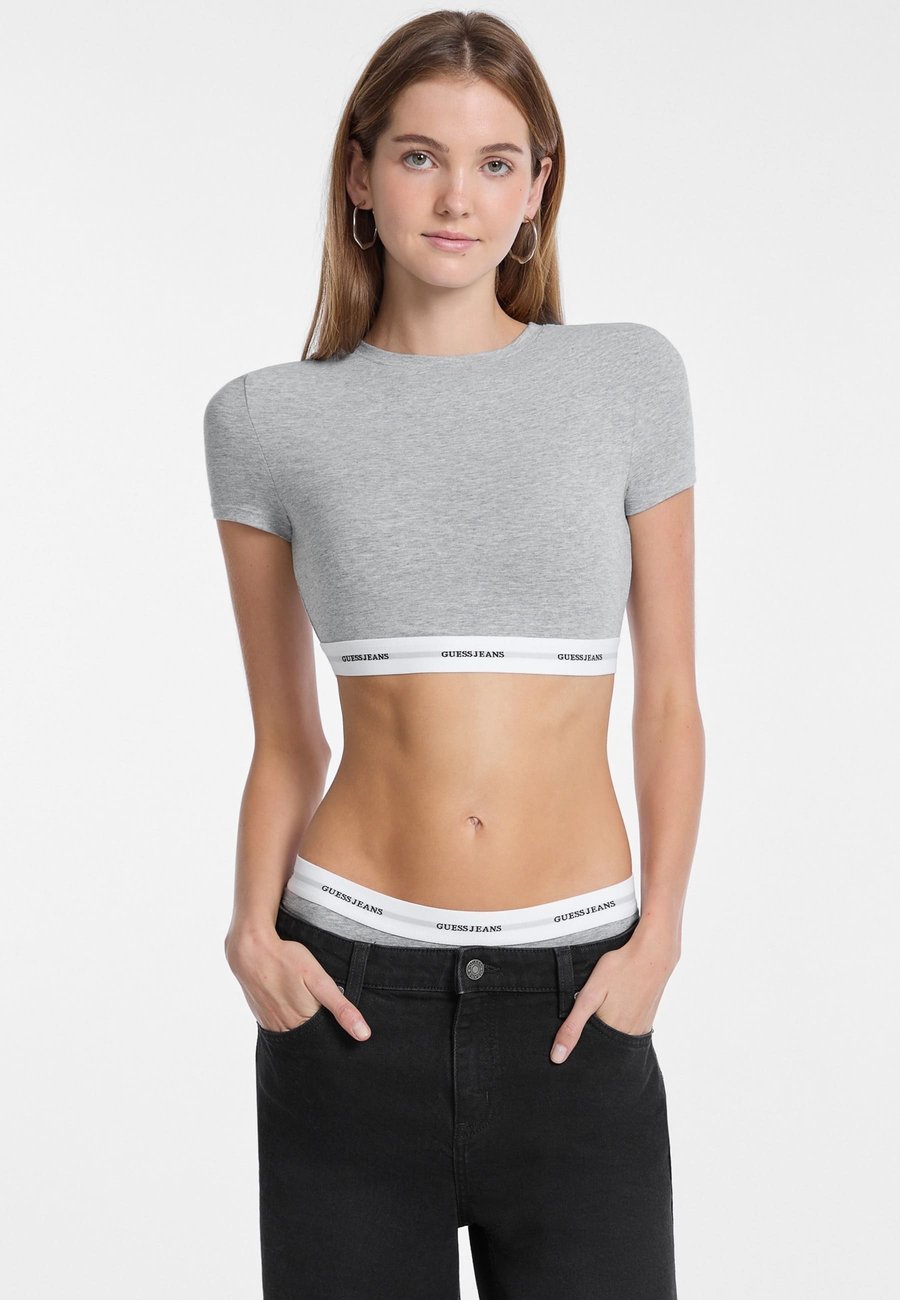 Топ Guess CROPPED LOGOSTREIFEN, Grau/Grey
Топ Guess CROPPED LOGOSTREIFEN, Grau/Grey