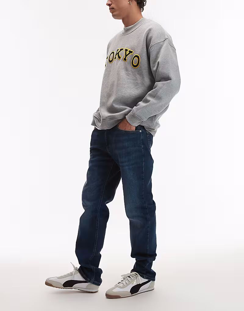 Джинсы Tommy Jeans Ryan Slim Straight темно-синего цвета
Джинсы Tommy Jeans Ryan Slim Straight темно-синего цвета