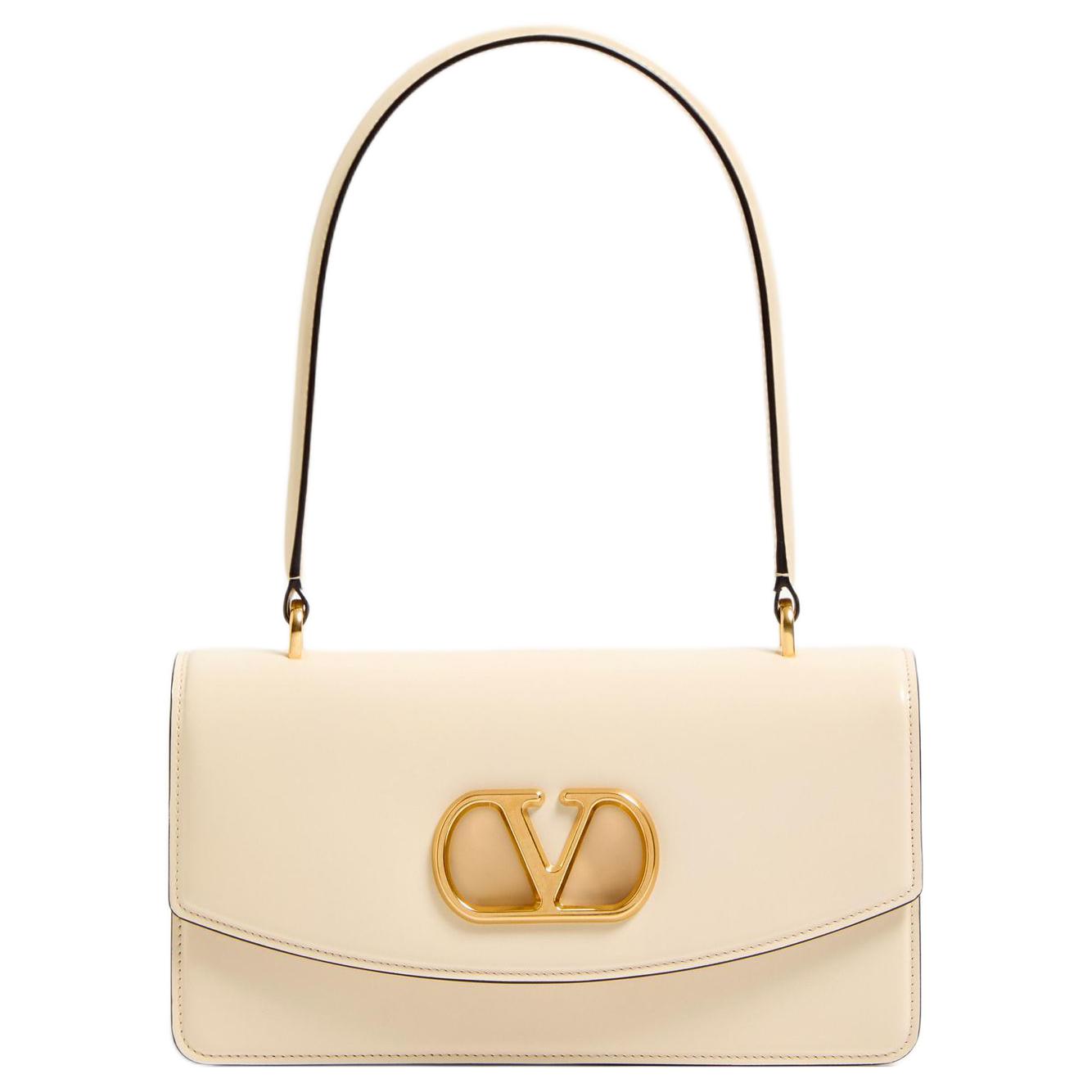 Valentino Сумка через плечо из яркой телячьей кожи кремово-белого цвета
Valentino Сумка через плечо из яркой телячьей кожи кремово-белого цвета