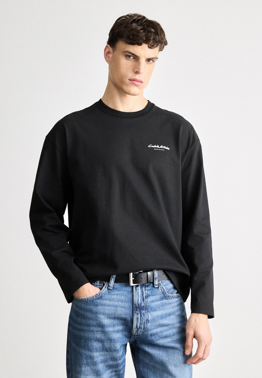 Топ Calvin Klein GRAPHIC TEE, Black
Топ Calvin Klein GRAPHIC TEE, Black