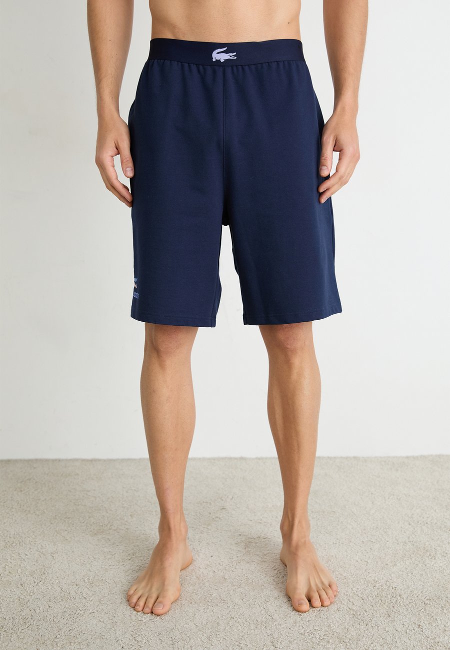 Пижамные брюки Lacoste LOUNGEWEAR SHORTS, Navy Blue/Delphinium/Dark Blue
Пижамные брюки Lacoste LOUNGEWEAR SHORTS, Navy Blue/Delphinium/Dark Blue
