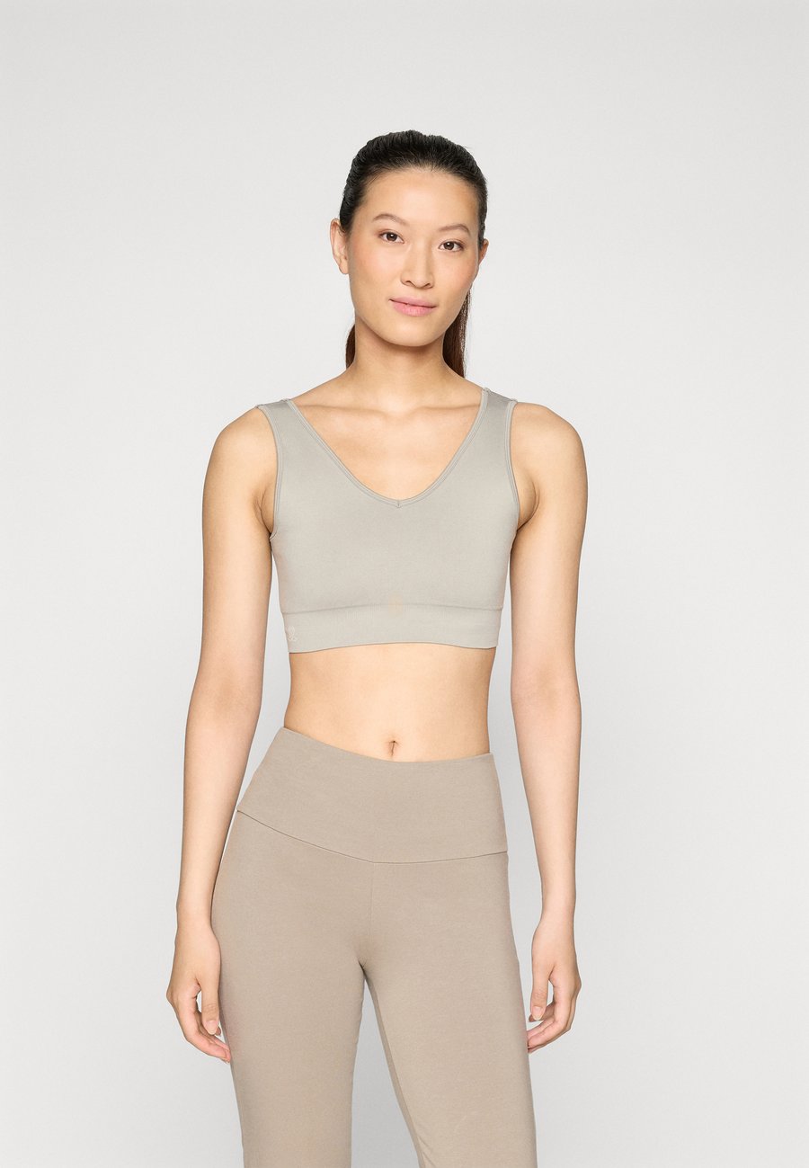 Бюстгальтер Yogasearcher TUNI SEAMLESS RECYCLED BRA, Cacao/Beige
Бюстгальтер Yogasearcher TUNI SEAMLESS RECYCLED BRA, Cacao/Beige