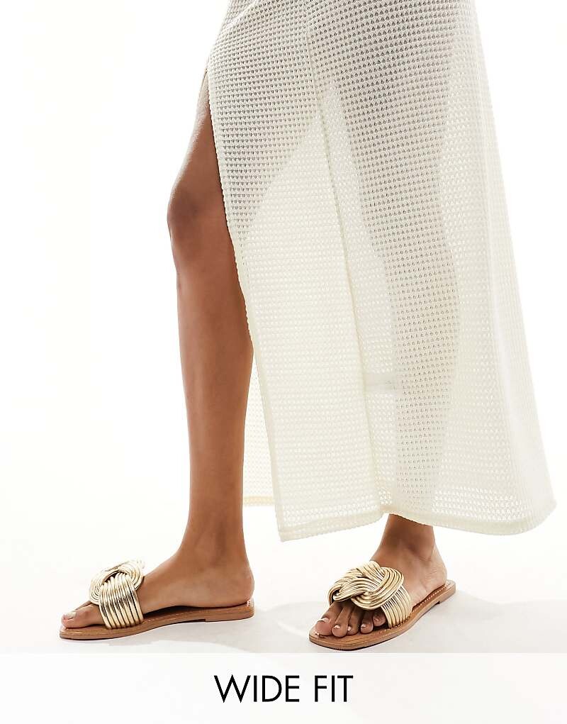 ASOS DESIGN Wide Fit – Fifi – Золотистые плетеные мюли на плоской подошве, широкий крой
ASOS DESIGN Wide Fit – Fifi – Золотистые плетеные мюли на плоской подошве, широкий крой