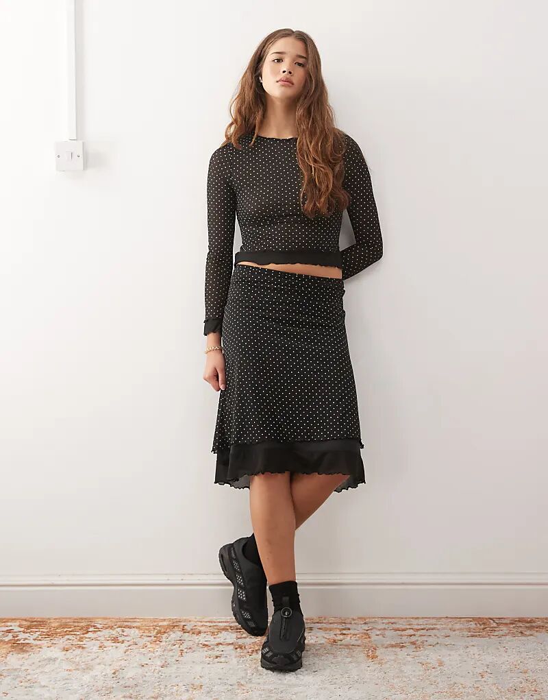 Юбка миди Reclaimed Vintage с контрастной отделкой в горошек
Юбка миди Reclaimed Vintage с контрастной отделкой в горошек