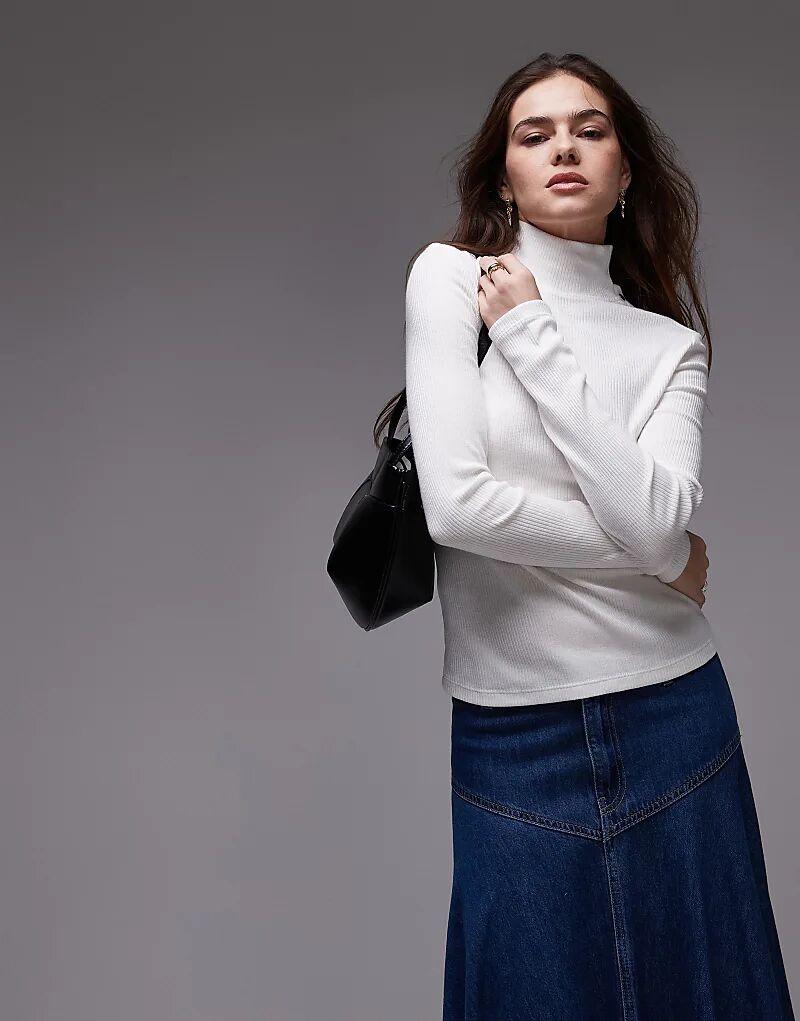 Топ с длинными рукавами и отделкой пуговицами на шее белого цвета Mango
Топ с длинными рукавами и отделкой пуговицами на шее белого цвета Mango