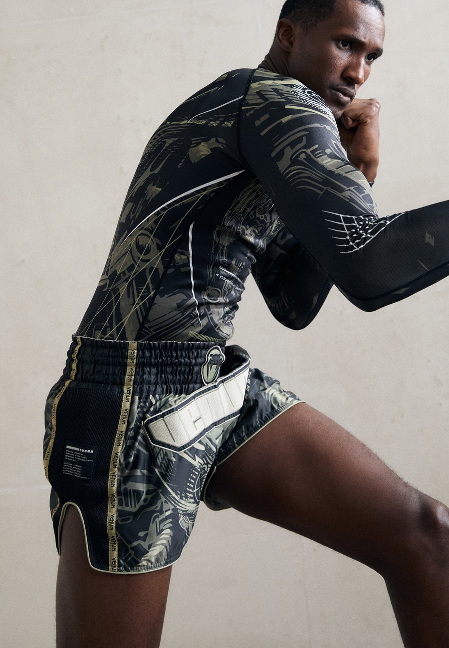 Спортивные шорты Venum INVADER MUAY THAI SHORTS, Black/Sand/Black
Спортивные шорты Venum INVADER MUAY THAI SHORTS, Black/Sand/Black