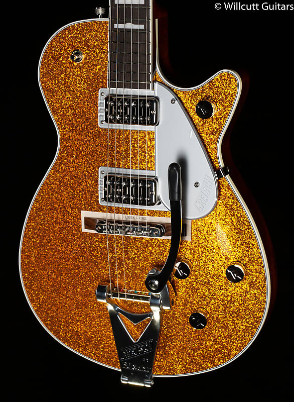 Электрогитара Gretsch G6129T-89 Vintage Select ‘89 Sparkle Jet with Bigsby, Rosewood Fingerboard, Gold Sparkle - JT21051972-8.28 lbs
Электрогитара Gretsch G6129T-89 Vintage Select ‘89 Sparkle Jet with Bigsby, Rosewood Fingerboard, Gold Sparkle - JT21051972-8.28 lbs