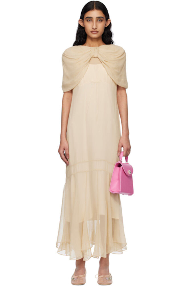 Бежевое длинное платье с бантом и несколькими швами Simone Rocha
Бежевое длинное платье с бантом и несколькими швами Simone Rocha