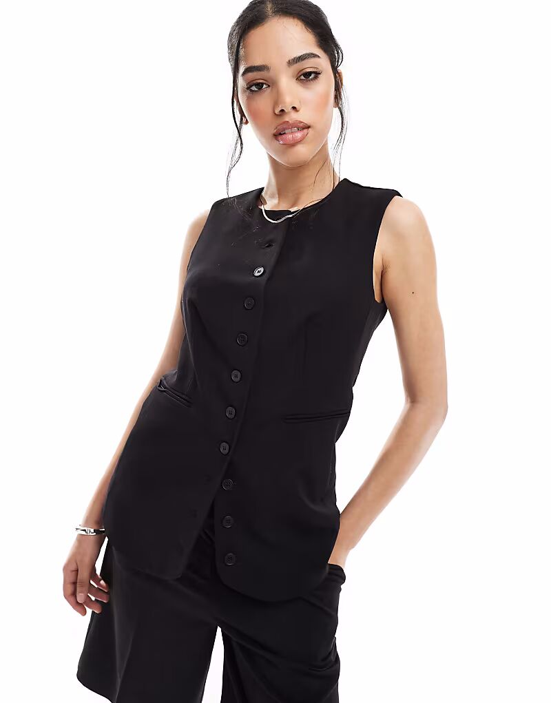 Удлиненный жилет Pieces черного цвета
Удлиненный жилет Pieces черного цвета