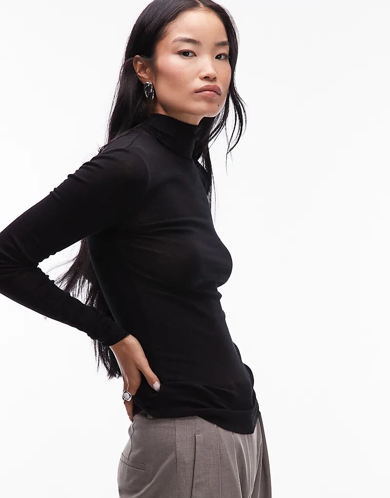 Вязаный полупрозрачный топ ARKET из мериносовой шерсти с высоким воротом черного цвета
Вязаный полупрозрачный топ ARKET из мериносовой шерсти с высоким воротом черного цвета