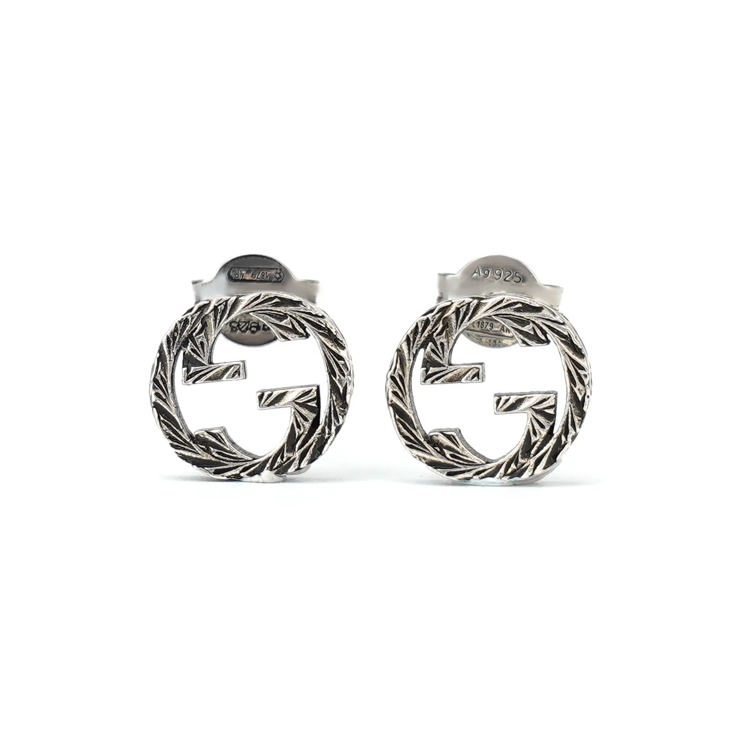 GUCCI Серьги-гвоздики из стерлингового серебра с переплетающимся дизайном
GUCCI Серьги-гвоздики из стерлингового серебра с переплетающимся дизайном