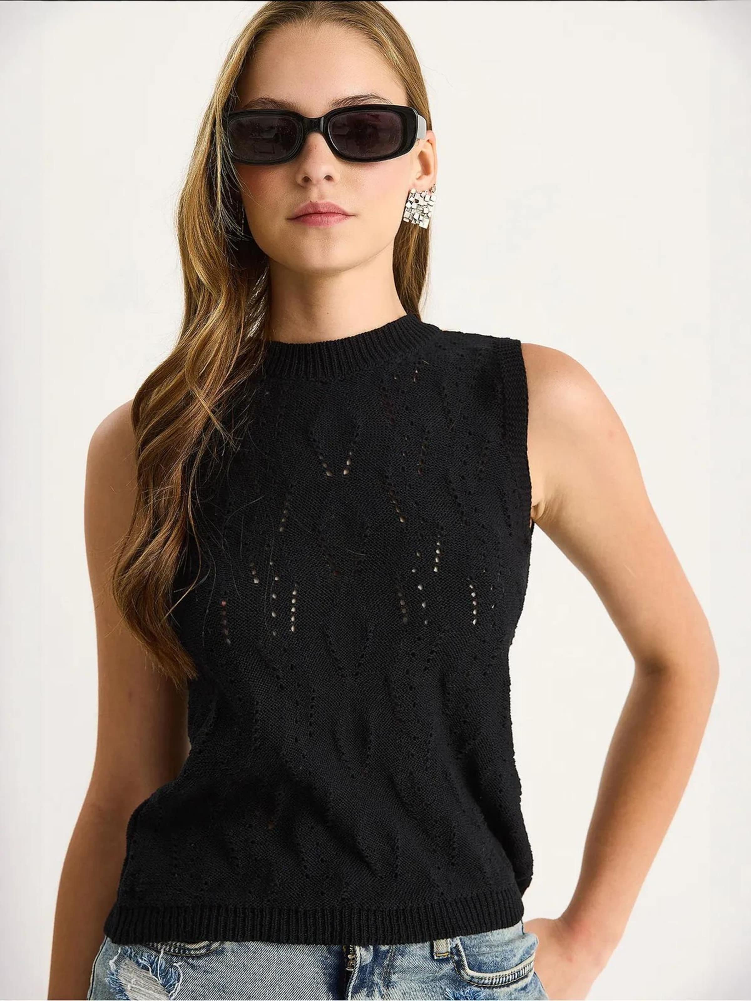 Bianco Lucci Вязаный топ черного цвета
Bianco Lucci Вязаный топ черного цвета