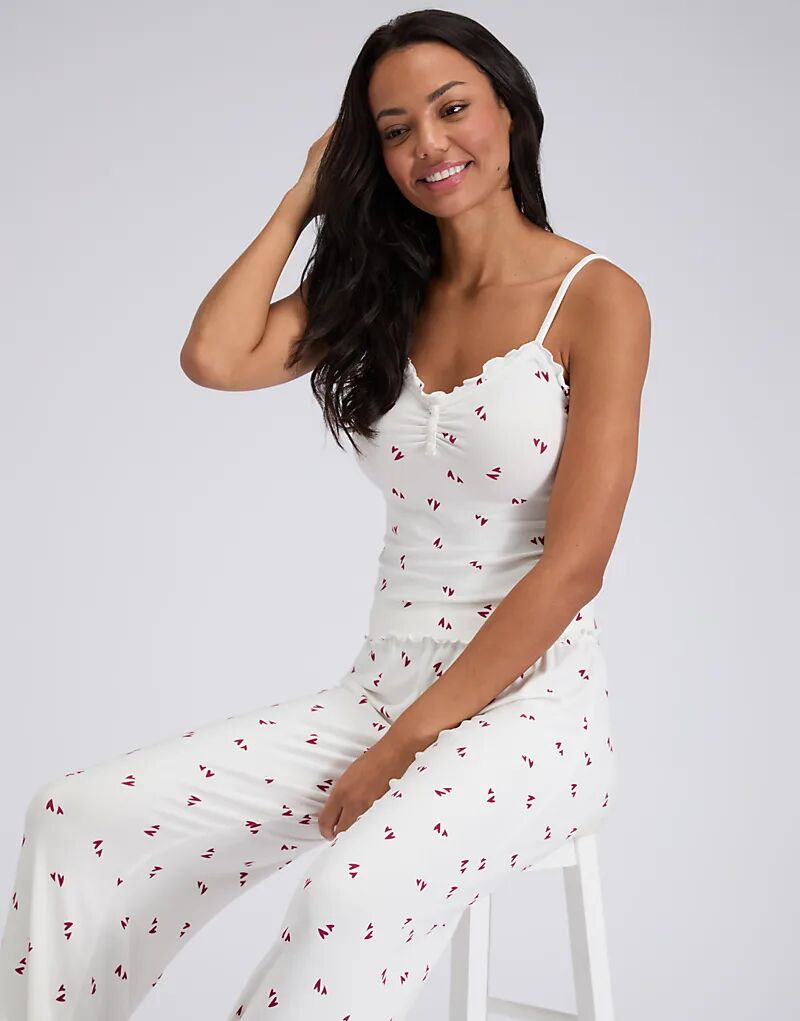 Boux Avenue Супермягкий пижамный комплект из топа и брюк с сердечками в цвете слоновой кости
Boux Avenue Супермягкий пижамный комплект из топа и брюк с сердечками в цвете слоновой кости