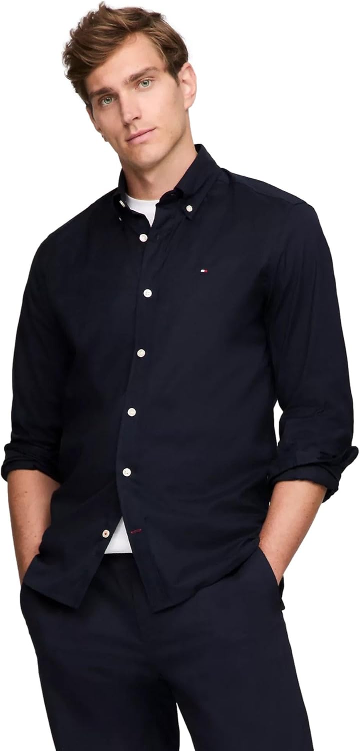 Мужская фирменная рубашка TOMMY HILFIGER с длинным рукавом и застежкой на пуговицы, классического кроя, коллекция 2025 года, French Navy.
Мужская фирменная рубашка TOMMY HILFIGER с длинным рукавом и застежкой на пуговицы, классического кроя, коллекция 2025 года, French Navy.