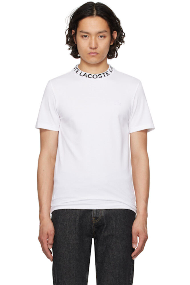 Белая двухцветная футболка с жаккардовым воротником, стандартного кроя Lacoste
Белая двухцветная футболка с жаккардовым воротником, стандартного кроя Lacoste