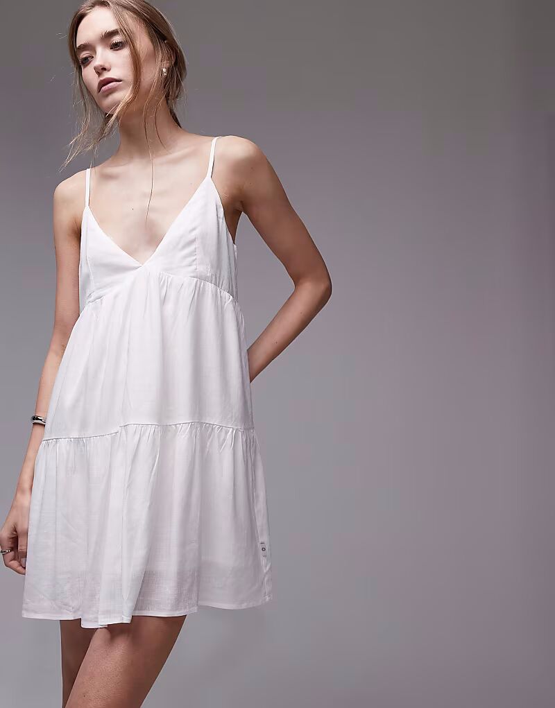 Классическое многоярусное пляжное мини-платье Rhythm белого цвета
Классическое многоярусное пляжное мини-платье Rhythm белого цвета