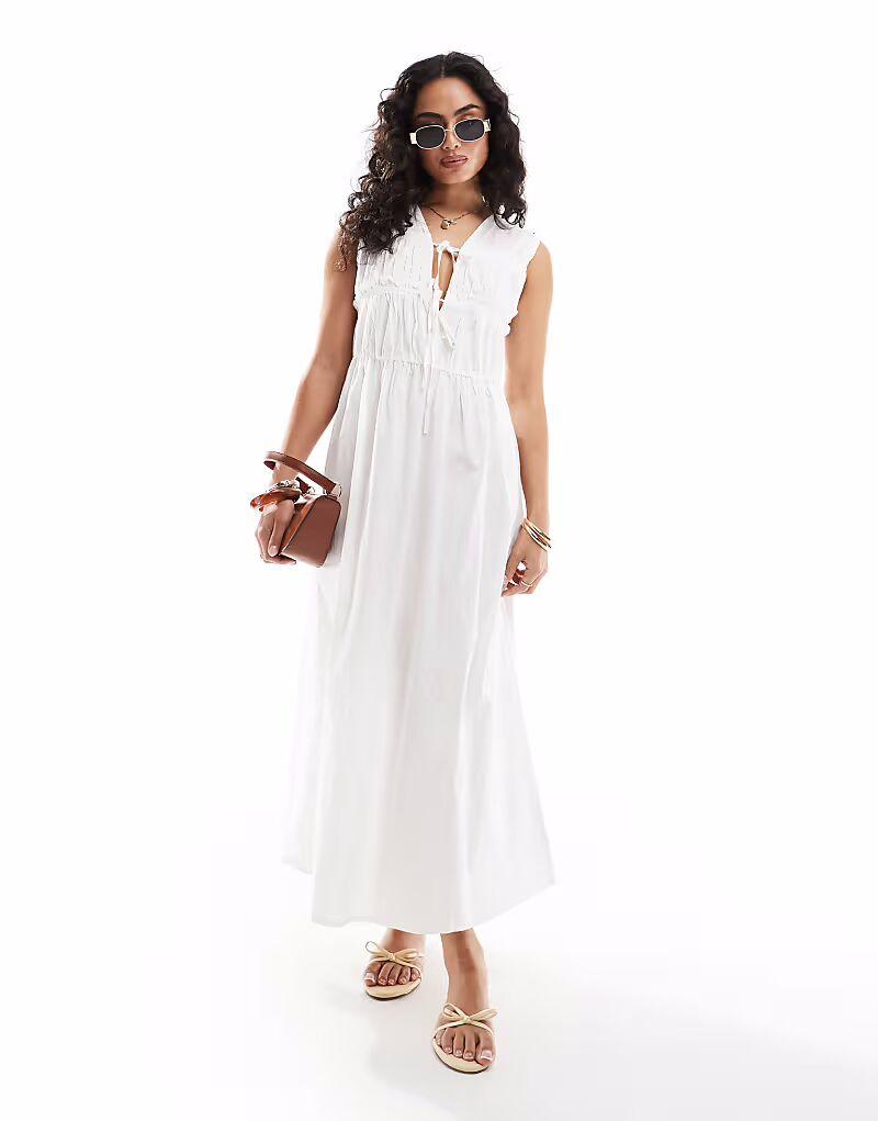 Платье мидакси из хлопка ONLY с завязками спереди и сборками белого цвета
Платье мидакси из хлопка ONLY с завязками спереди и сборками белого цвета