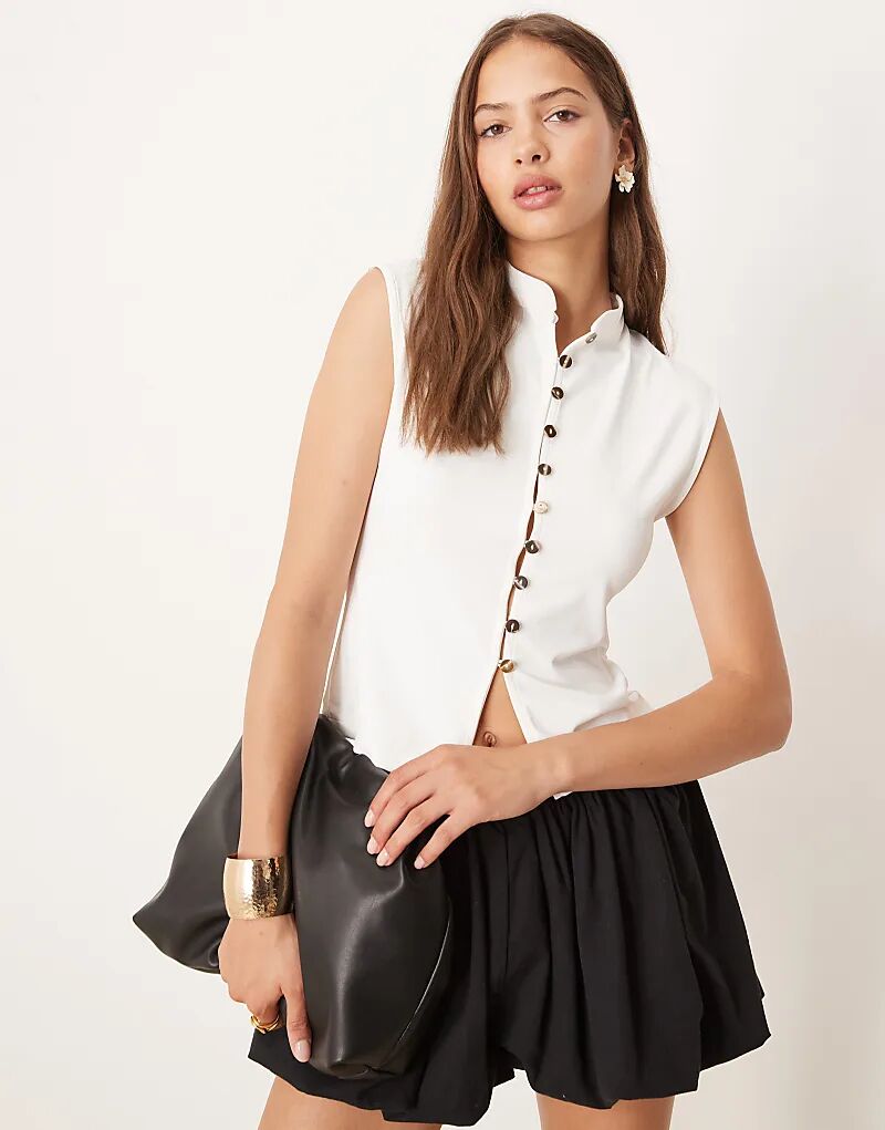 Топ из полиамида с пуговицами на рукавах ASOS DESIGN цвета слоновой кости
Топ из полиамида с пуговицами на рукавах ASOS DESIGN цвета слоновой кости