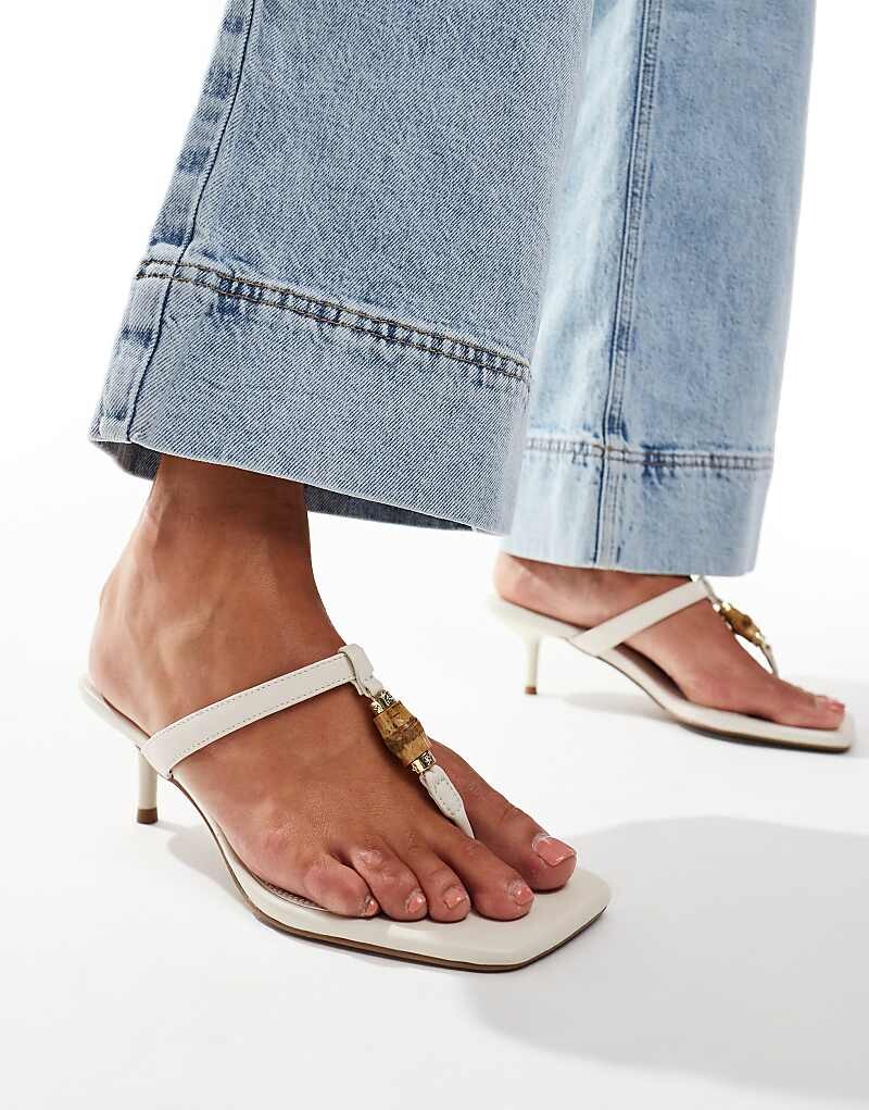 Белые шлепанцы на низком каблуке ASOS DESIGN Harmonica – Sanda с бамбуковым декором
Белые шлепанцы на низком каблуке ASOS DESIGN Harmonica – Sanda с бамбуковым декором