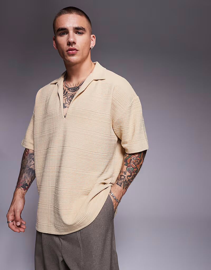 Текстурированное поло свободного кроя ASOS DESIGN с воротником-стойкой цвета «камень»
Текстурированное поло свободного кроя ASOS DESIGN с воротником-стойкой цвета «камень»