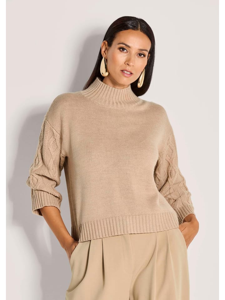 MADELEINE Элегантный бежевый шерстяной свитер с косами
MADELEINE Элегантный бежевый шерстяной свитер с косами