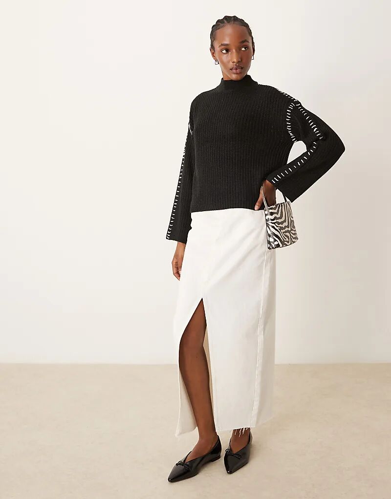 Вязаный джемпер с высоким воротом и контрастной строчкой черного цвета Vila
Вязаный джемпер с высоким воротом и контрастной строчкой черного цвета Vila