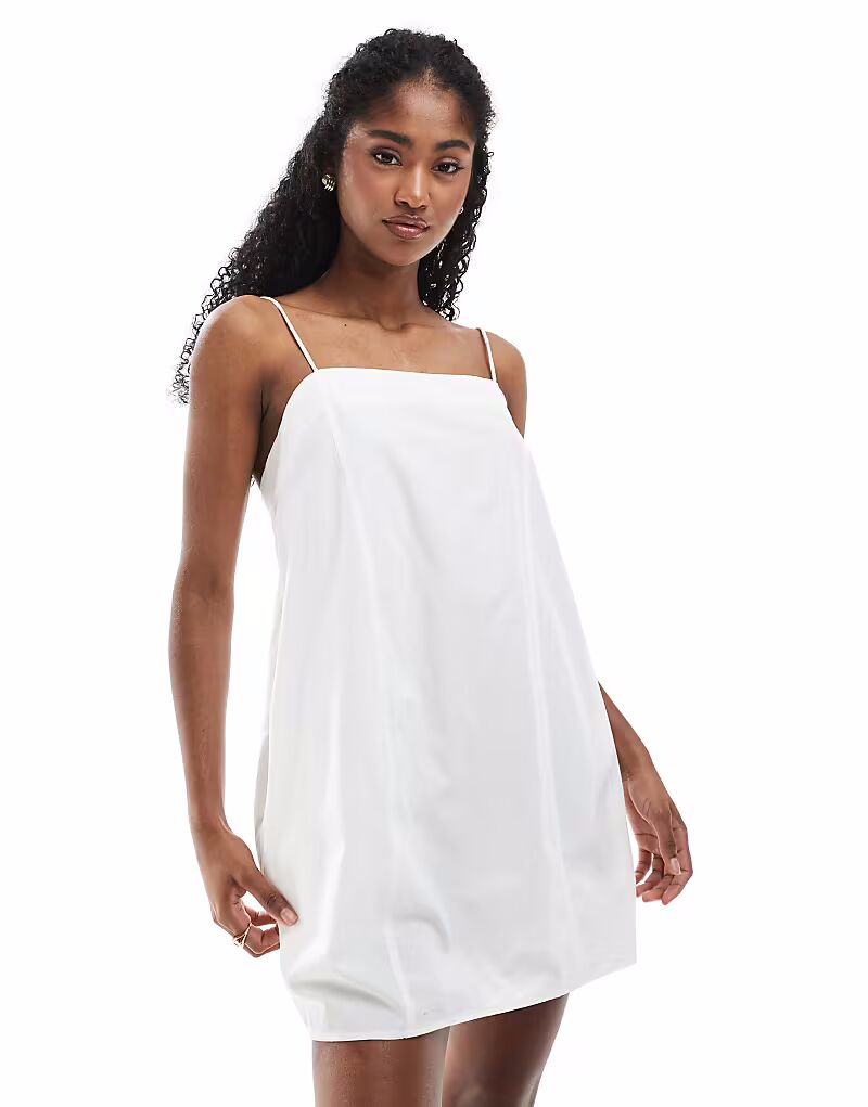 Мини-платье Monki из хлопкового поплина с завязками белого цвета
Мини-платье Monki из хлопкового поплина с завязками белого цвета