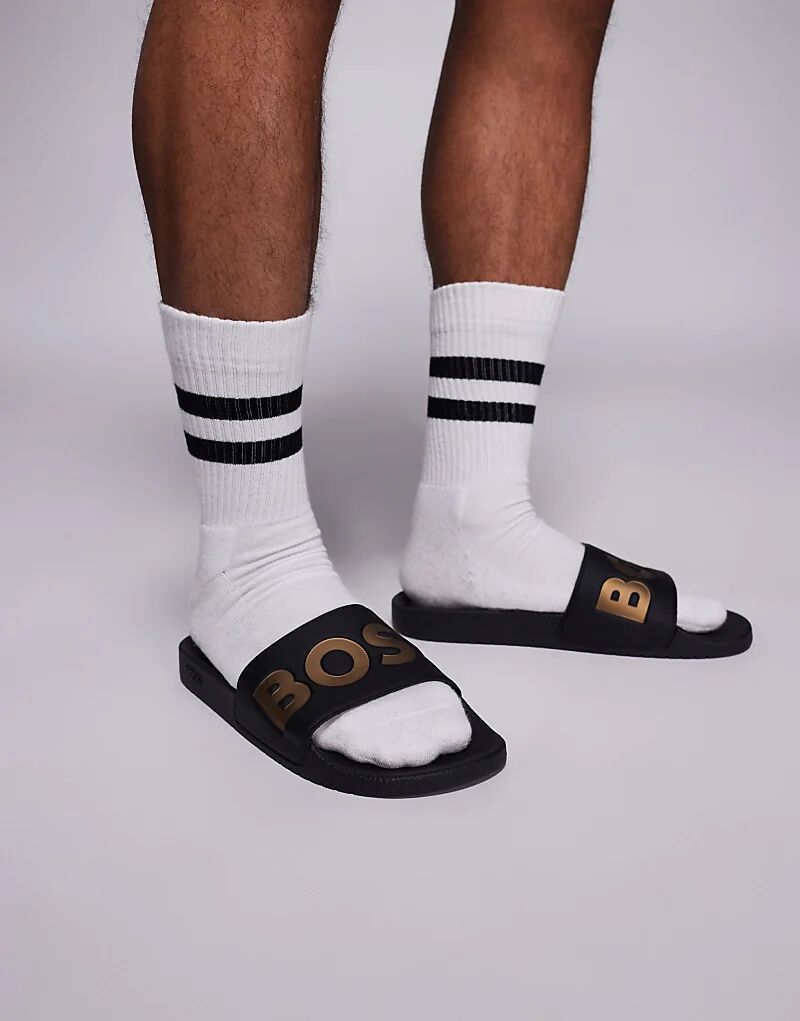 Шлепанцы с контрастным логотипом BOSS Aryeh черного и золотого цветов Boss Orange
Шлепанцы с контрастным логотипом BOSS Aryeh черного и золотого цветов Boss Orange