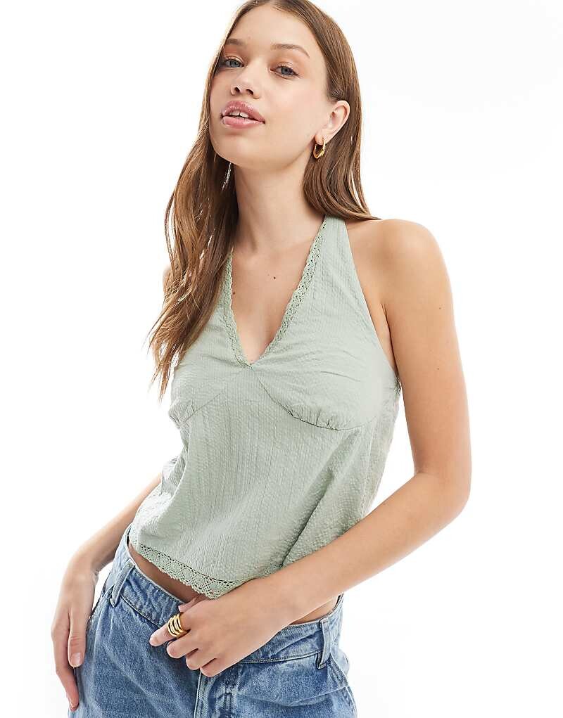 Cotton On — льняной топ цвета хаки с воротником-хомутом на пуговицах
Cotton On — льняной топ цвета хаки с воротником-хомутом на пуговицах