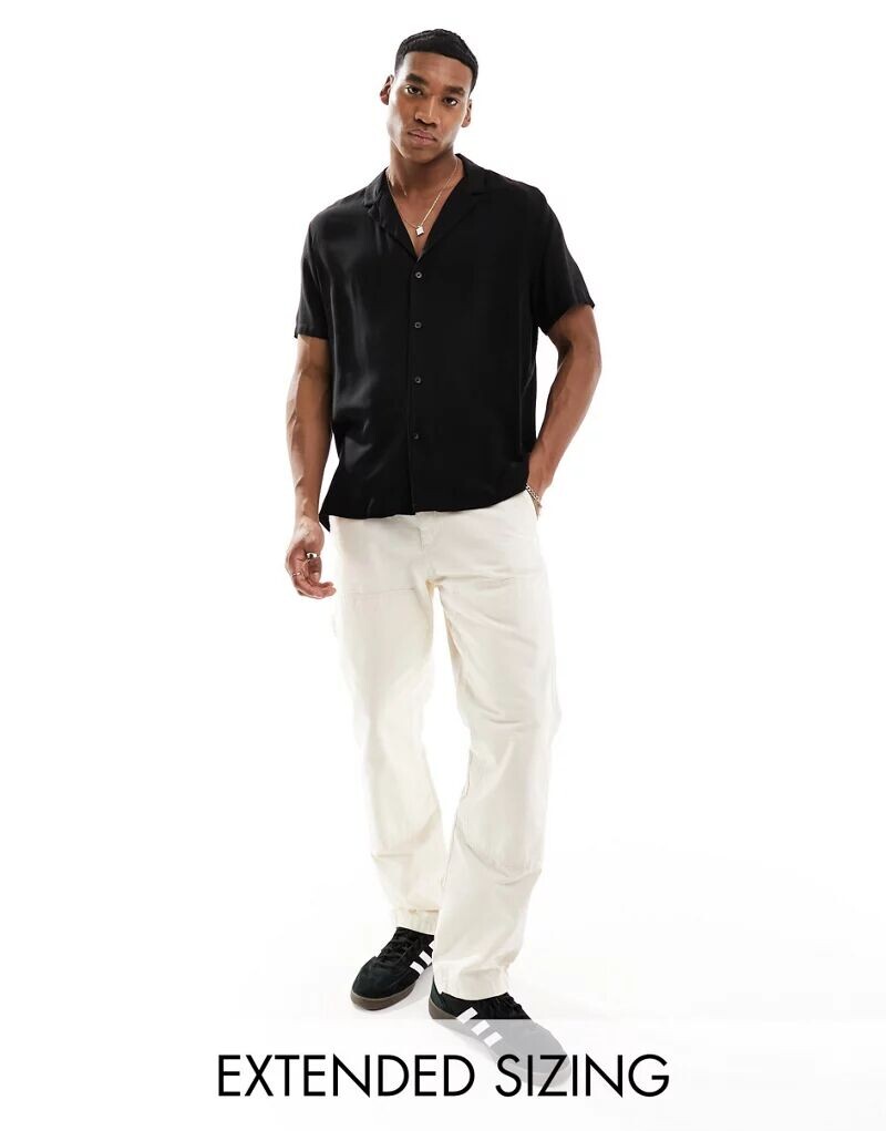 Черная вискозная рубашка с широкими лацканами и свободным кроем ASOS
Черная вискозная рубашка с широкими лацканами и свободным кроем ASOS