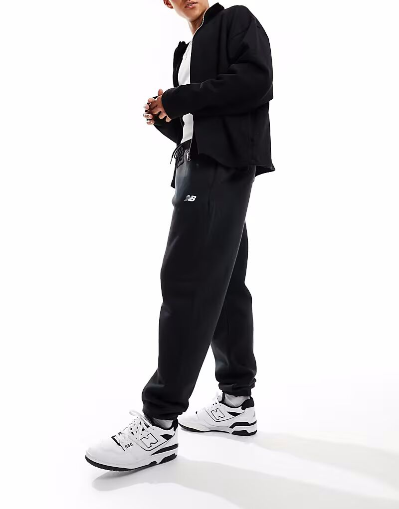 Черные флисовые джоггеры New Balance Sport Essentials
Черные флисовые джоггеры New Balance Sport Essentials