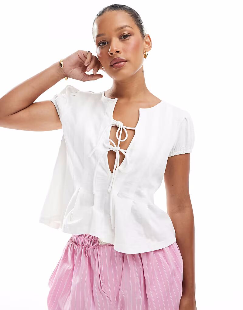 Топ с завязками спереди ASOS DESIGN кремового цвета со складками
Топ с завязками спереди ASOS DESIGN кремового цвета со складками