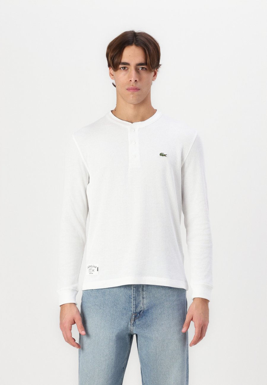 Топ Lacoste Long sleeved top, Flour/Off-White
Топ Lacoste Long sleeved top, Flour/Off-White