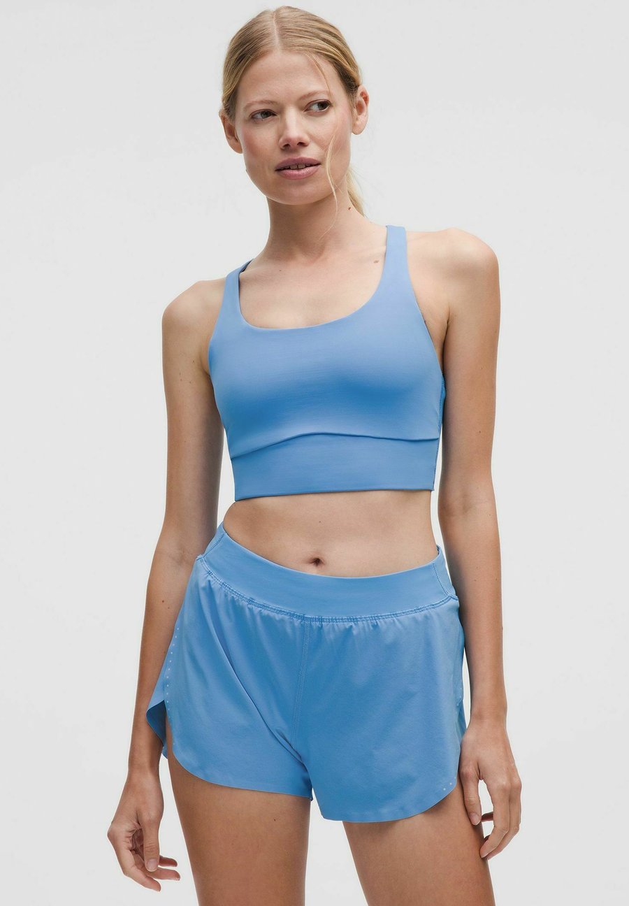 Бюстгальтер lululemon Medium support sports bra, Pool Party/Blue
Бюстгальтер lululemon Medium support sports bra, Pool Party/Blue