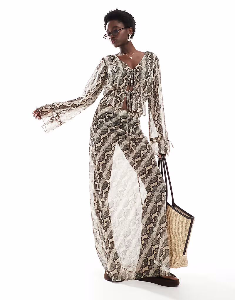 Прозрачная пляжная юбка Wednesday's Girl со змеиным принтом, коричневого цвета
Прозрачная пляжная юбка Wednesday's Girl со змеиным принтом, коричневого цвета