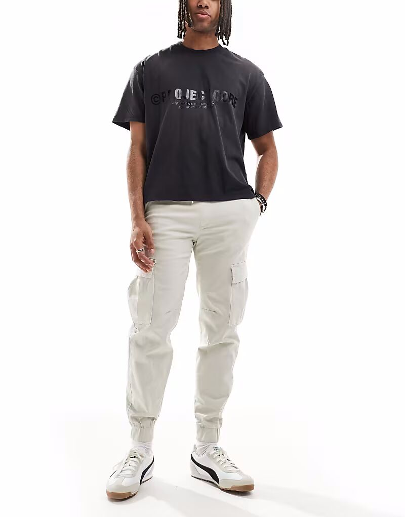 Брюки карго Bershka с манжетами бежевого цвета
Брюки карго Bershka с манжетами бежевого цвета