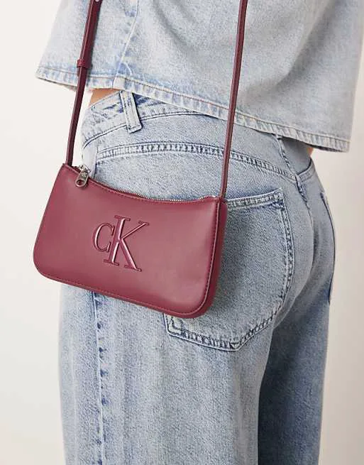 Бордовая мини-сумка с логотипом Calvin Klein Jeans
Бордовая мини-сумка с логотипом Calvin Klein Jeans
