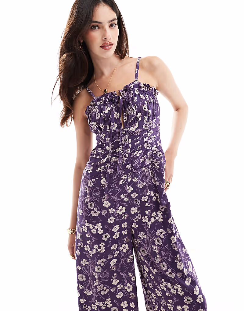 Комбинезон ASOS DESIGN с лифом, оборкой на груди, присборенной талией и бретельками, с фиолетовым и белым цветочным принтом
Комбинезон ASOS DESIGN с лифом, оборкой на груди, присборенной талией и бретельками, с фиолетовым и белым цветочным принтом