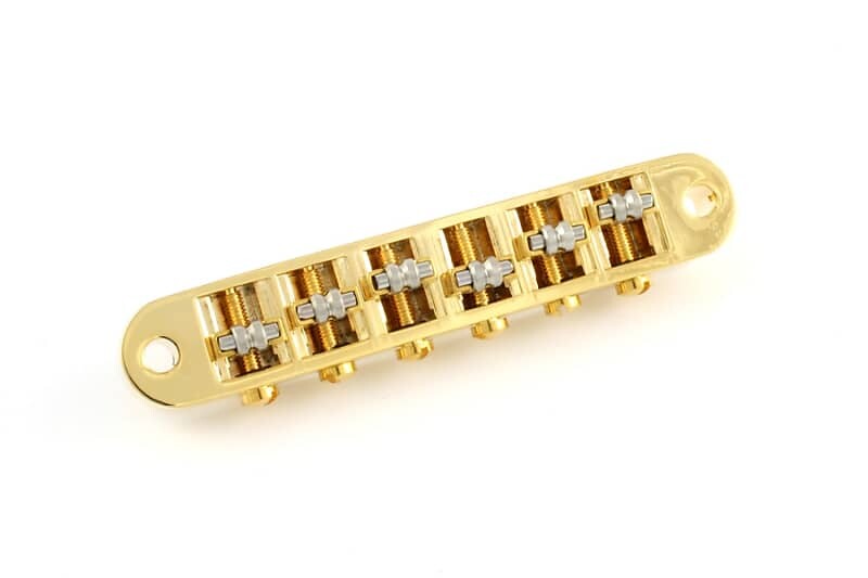 Роликовый бридж Tunematic с фурнитурой - GOLD Allparts GB-0595-002
Роликовый бридж Tunematic с фурнитурой - GOLD Allparts GB-0595-002