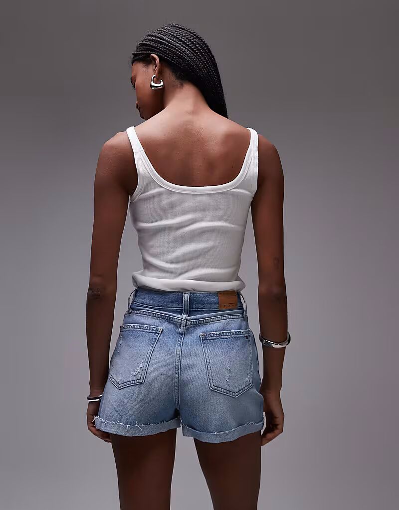 Короткие джинсовые шорты Tommy Jeans светло-голубого цвета
Короткие джинсовые шорты Tommy Jeans светло-голубого цвета